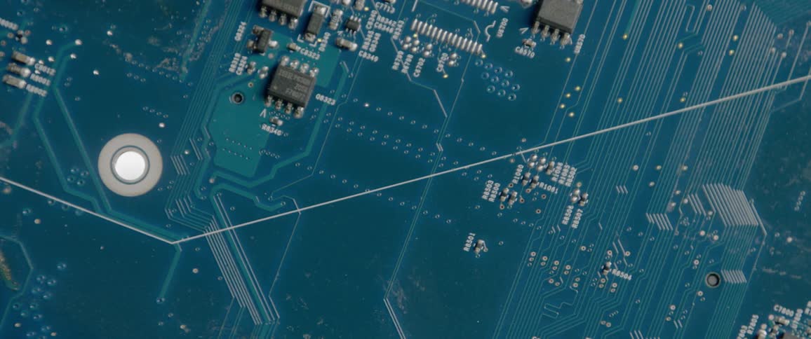 A light flashing behind a mother board and computer hardware