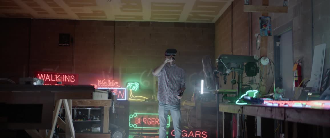 A man is using a virtual reality headset