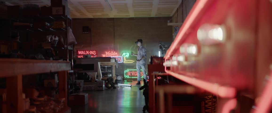 A young man plays with a virtual reality set