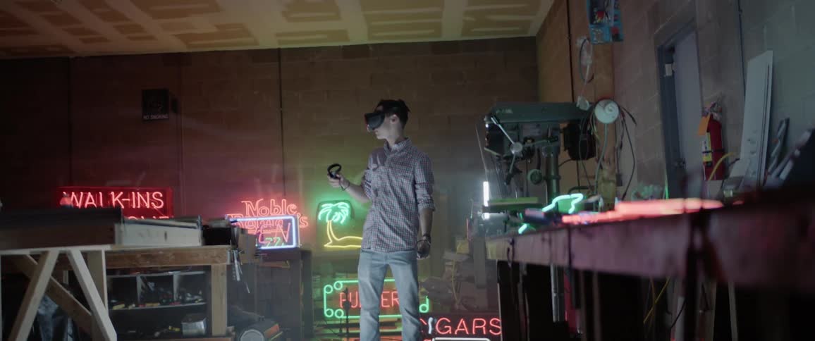 A man in a bar playing with a virtual reality headset