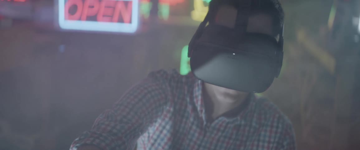 A man wears vr glasses inside a building