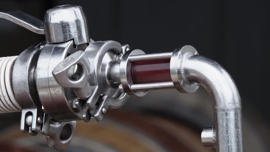 A person lifts the nozzle up