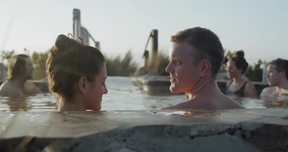 People sit in a hot tub and talk