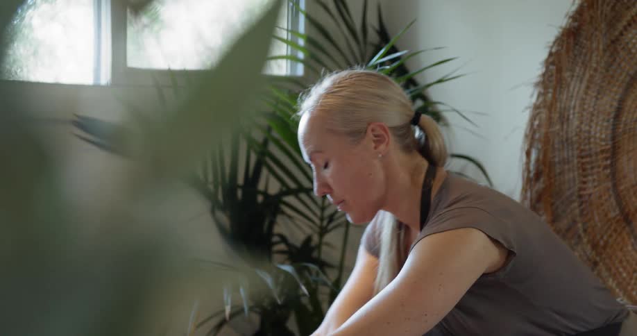 A female masseuse gives a patient a massage