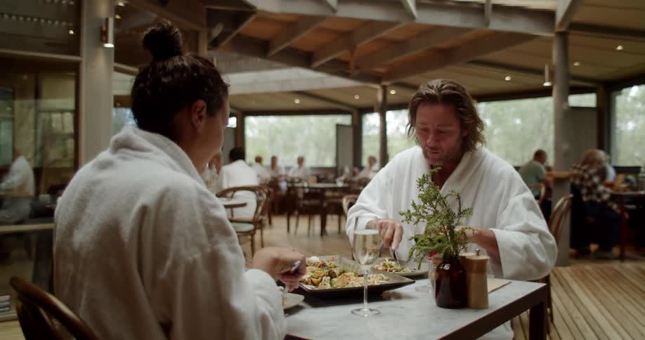 A man and woman have a meal together in the restaurant