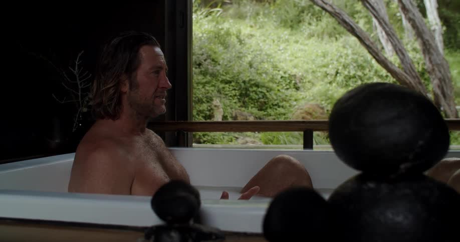 A couple are taking a bath together in the spa