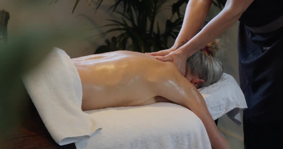 Woman laying on a massage table getting a massage