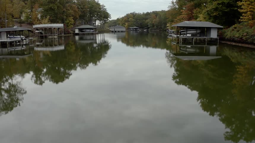 A river with docks and boats on either side