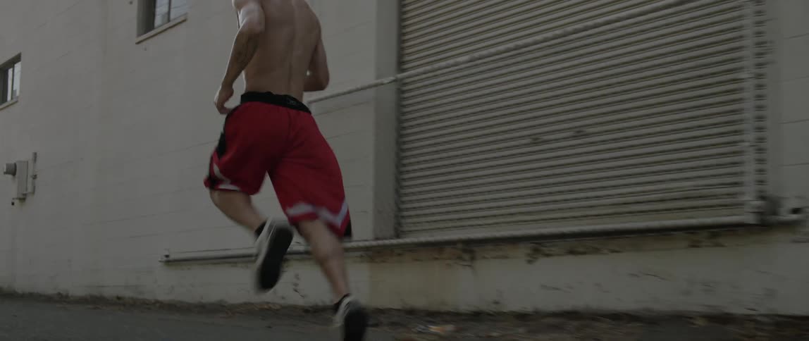 Man jogging down road