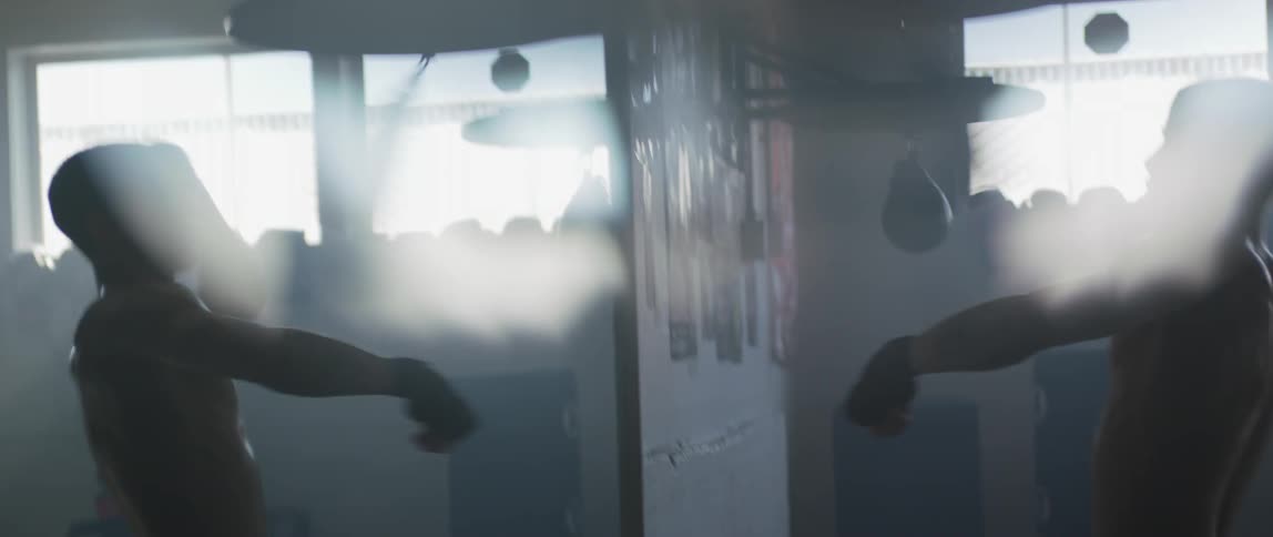 A man punching a punching bag