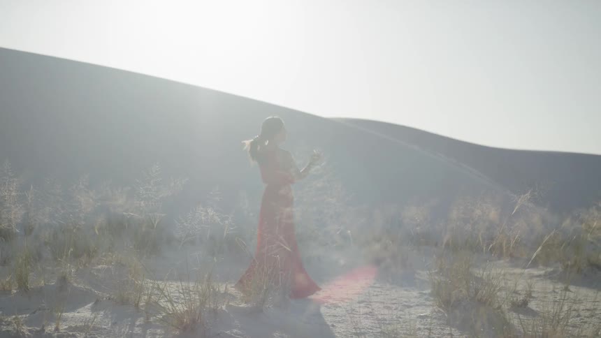 A woman walks in the fog