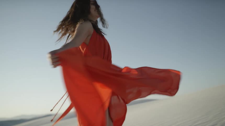 Girl in orange dress spinning
