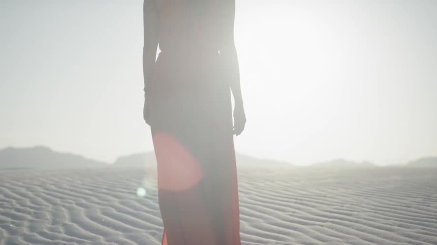 Girl walking in the desert