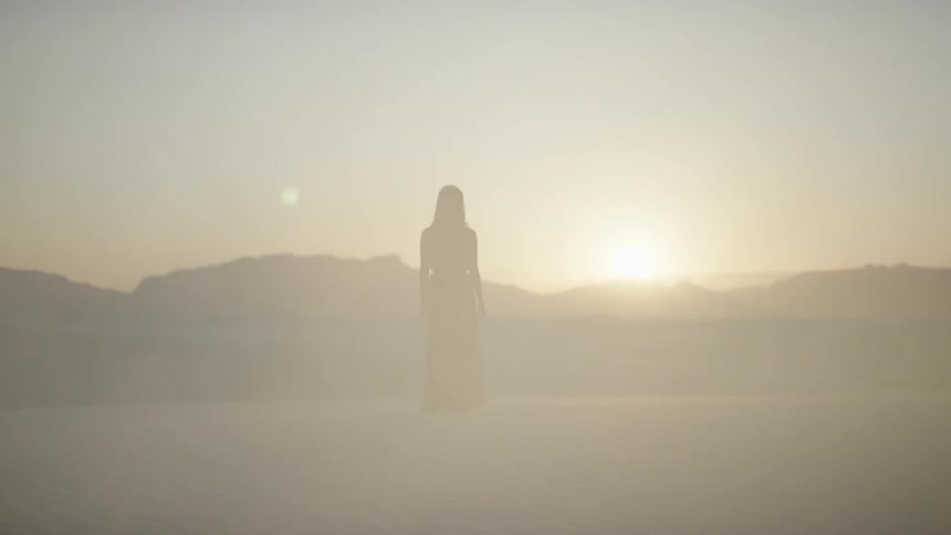 Girl walking in a dust cloud
