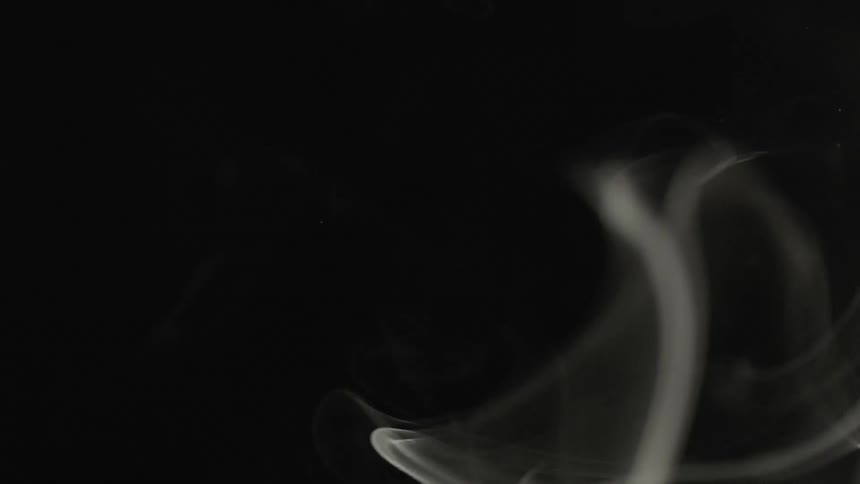 Smoke flows through the darkness