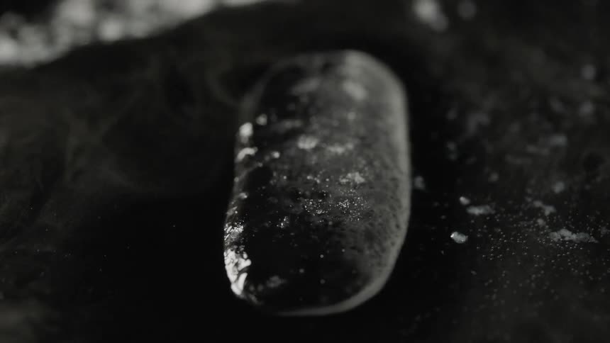 Water sprays over a cold surface and freezes