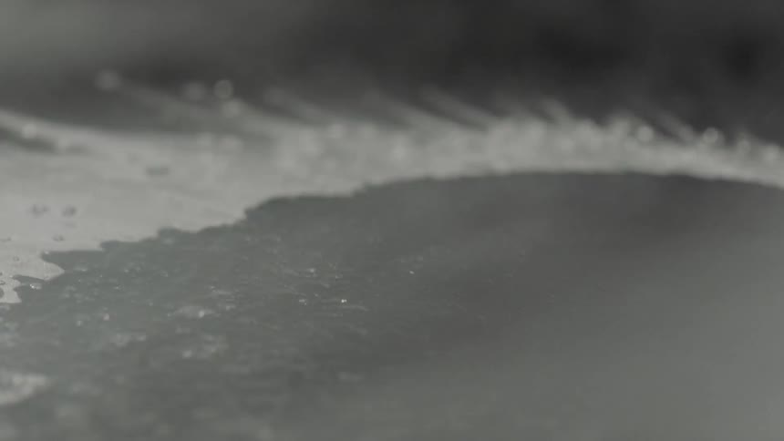 Steam and water flow over a black surface