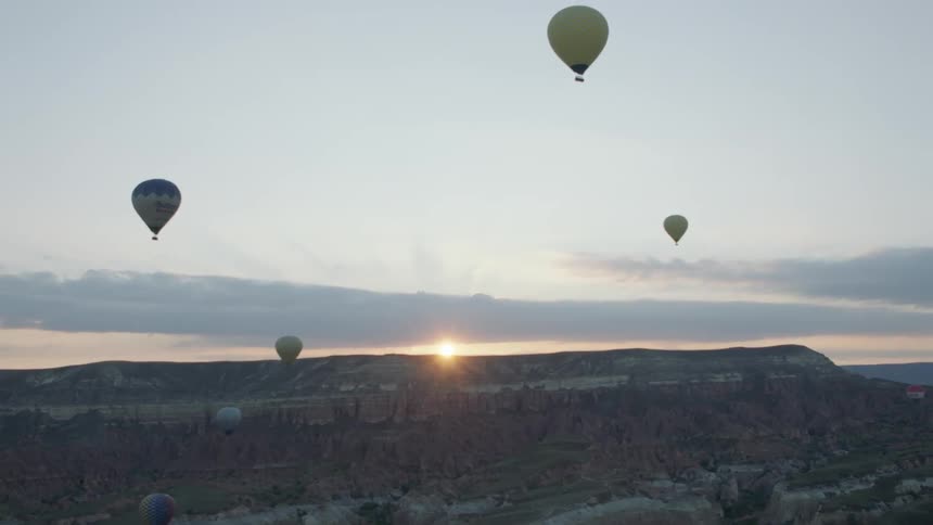 Shot of hot air balloons at dawn
