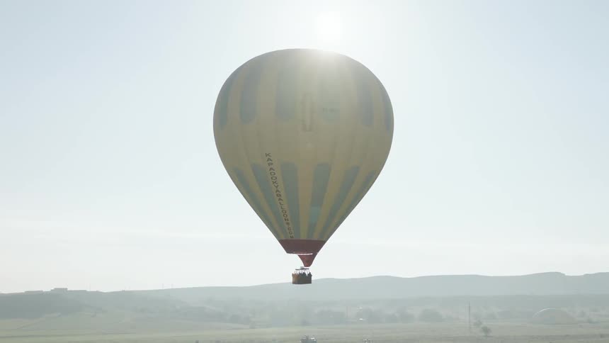 A hot air balloon sits in the sky