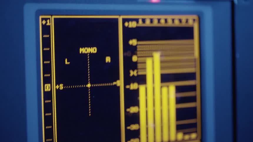 A monitor displays sound design data