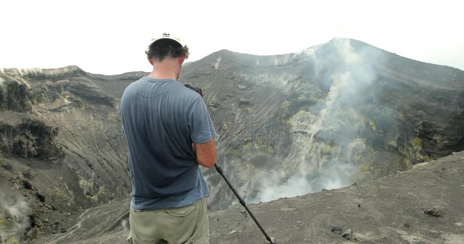 Explorers Climbing Volcano