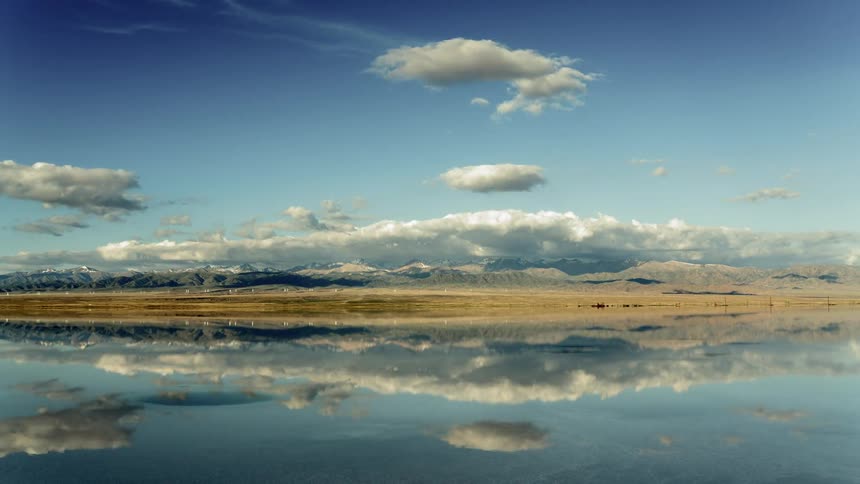 A scenery of a lake and mountain range