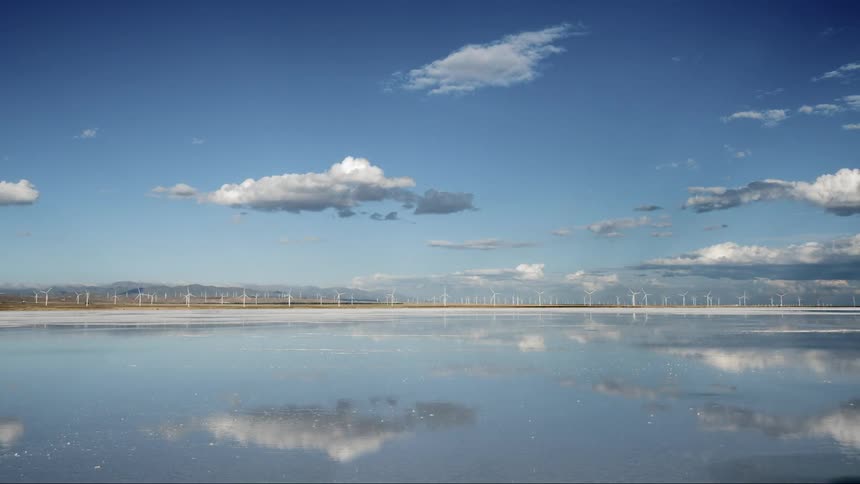 Windmill farm with water nearby
