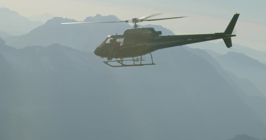 A helicopter flies in the sky