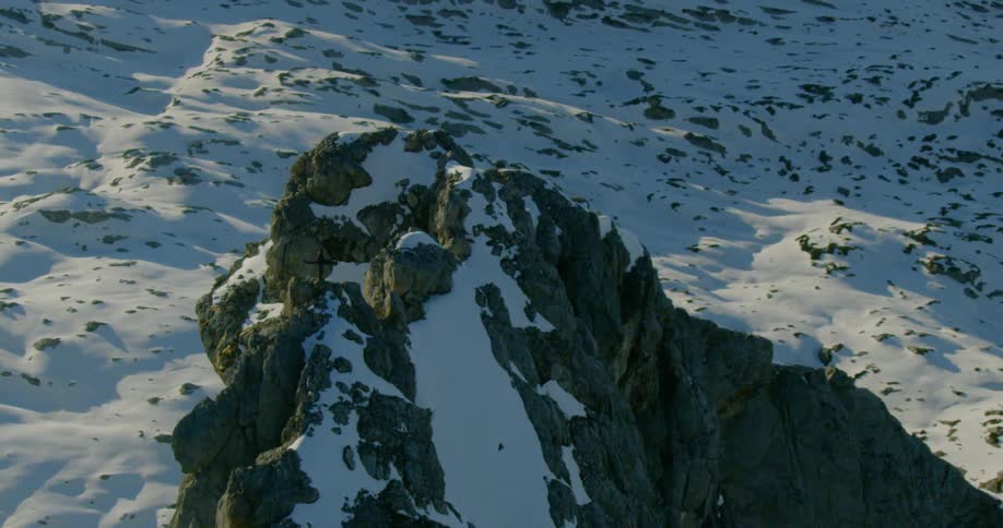 Ridge juts out of snowy slope