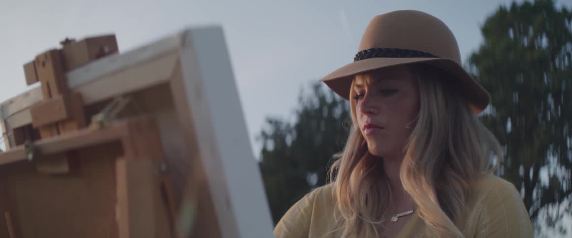 Woman painting in the park