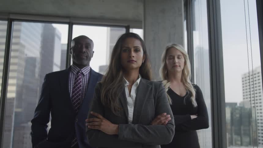 Three business people standing together