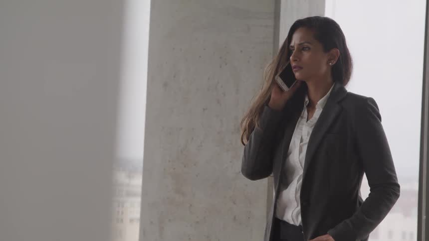 A woman is on her phone