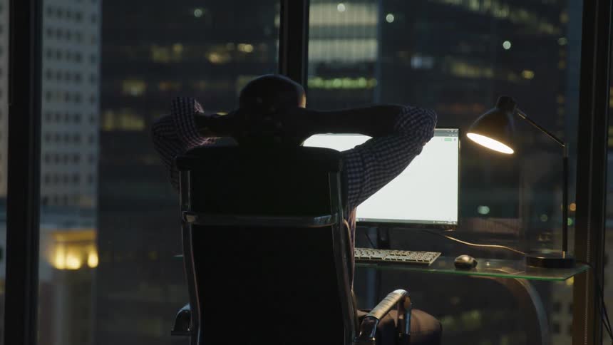 A man sits in front of the computer