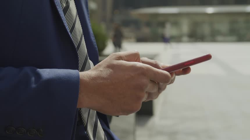 Man texting with his phone