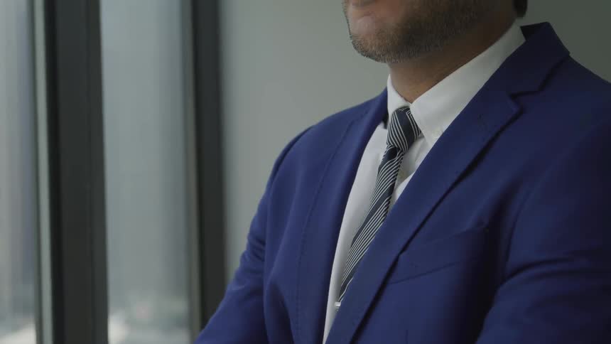 A young white man in a suit