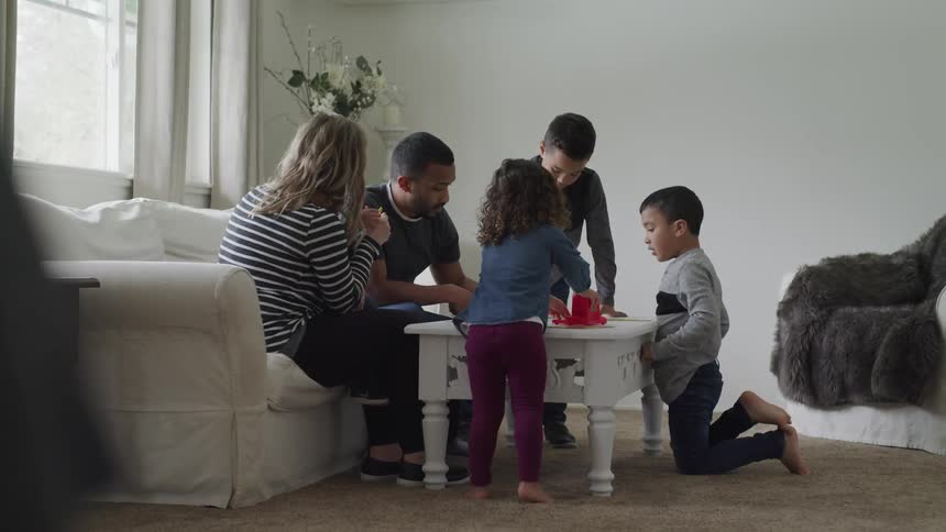 A family plays a game together