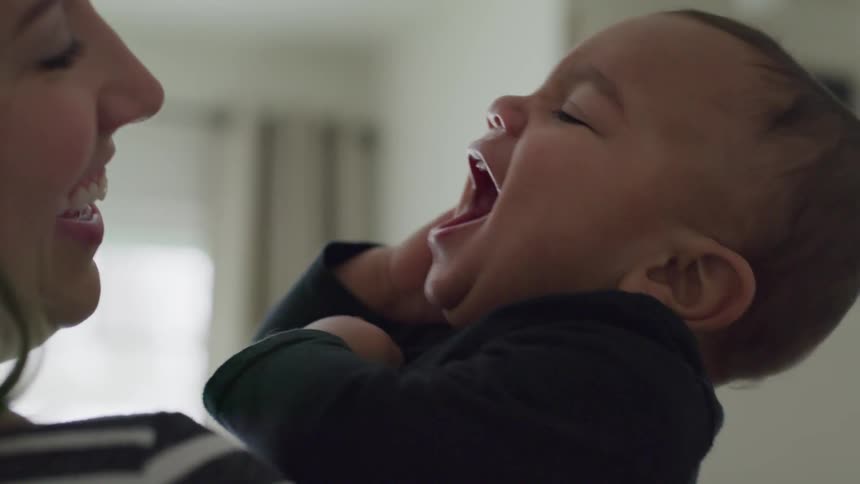 Mother play happily with her toddler