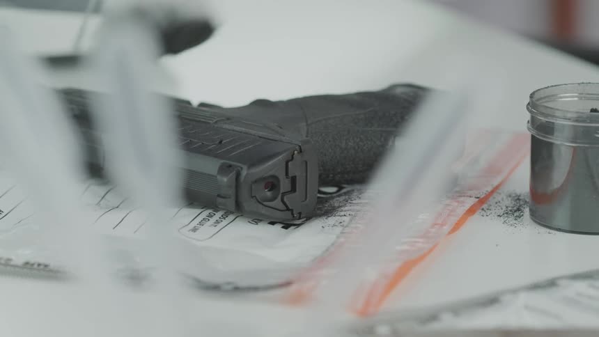 A person is cleaning off a piece of equipment