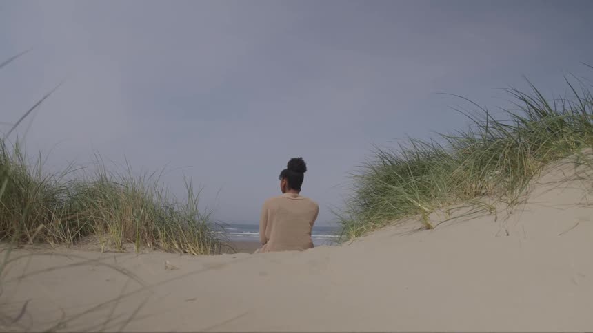 Woman teenager sit on the beach coastal