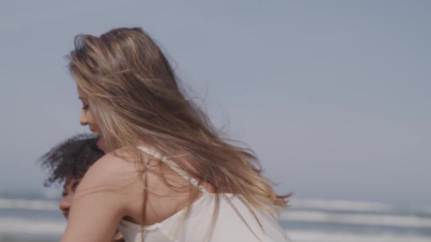 Two women have fun at the beach