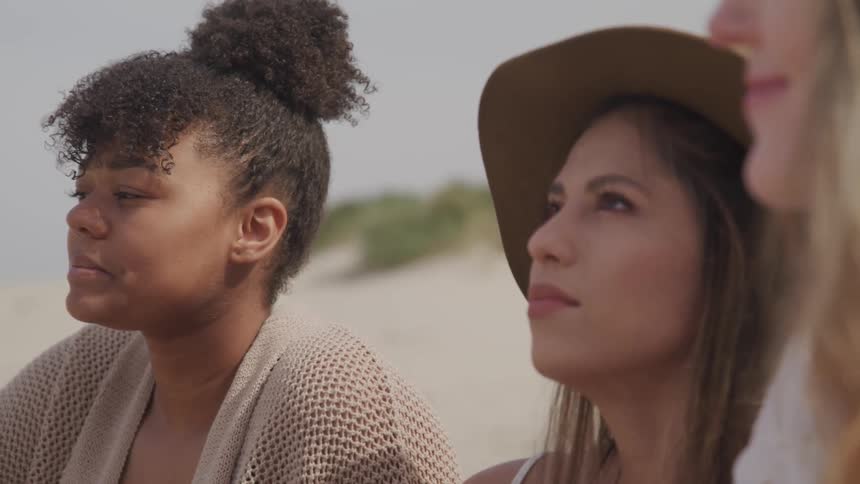 A group of woman staring at the sky