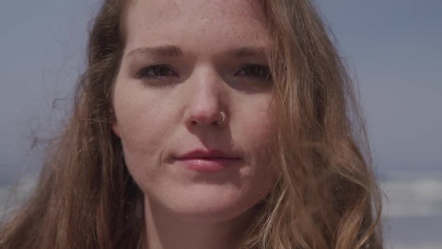 A woman opens her eyes