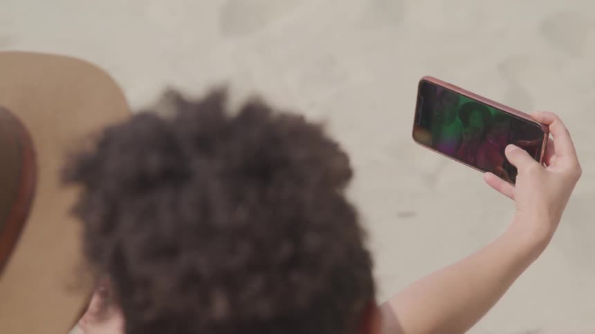 Two girls taking a picture on a smart phone