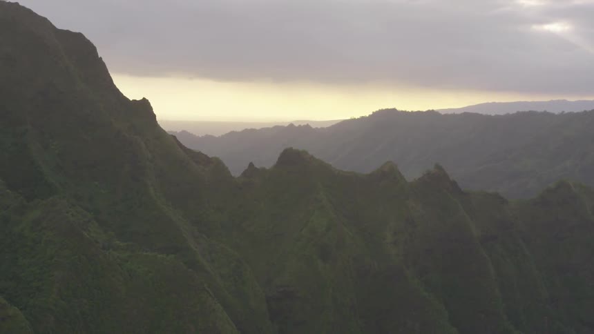 The mountains are high and covered with fog