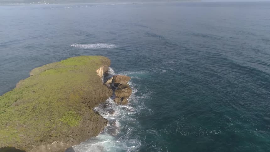 Landscape view of a rocky cliff on the shoreline