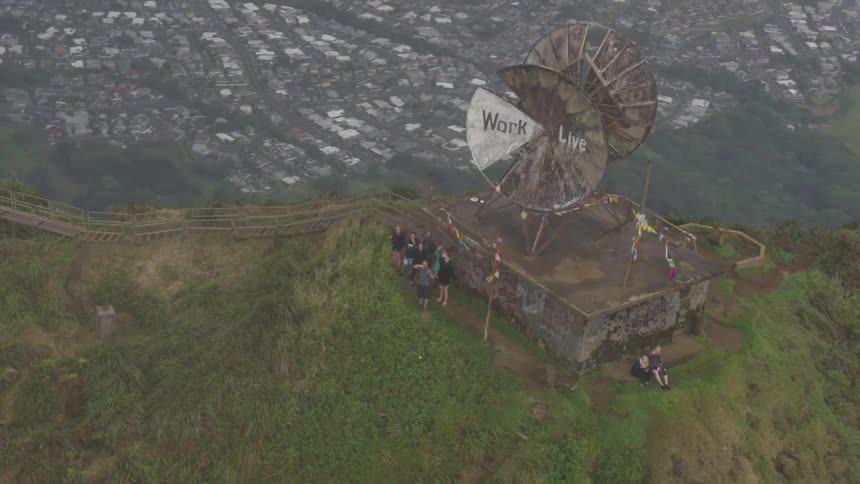 Ruins of broadcast antenna on mountain overlooking city