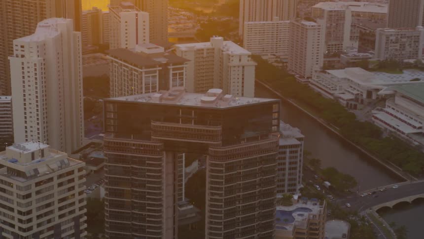A uniquely designed architectural building in the middle of a city skyline