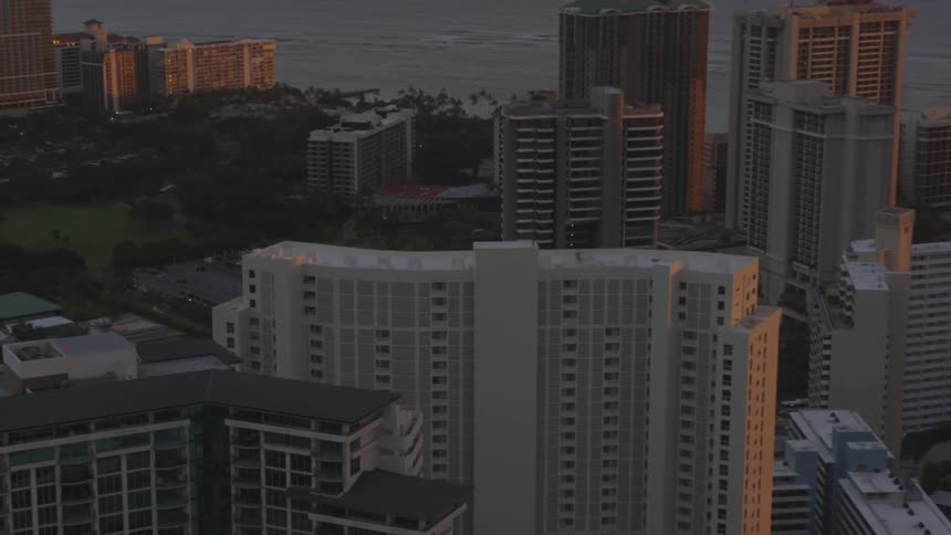 The buildings are tall in the city by the shore