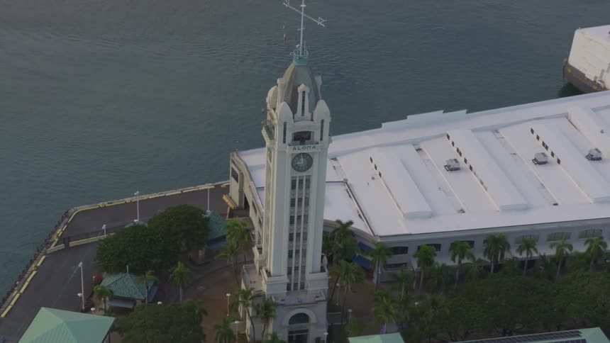 An aerial view of a waterfront clock tower