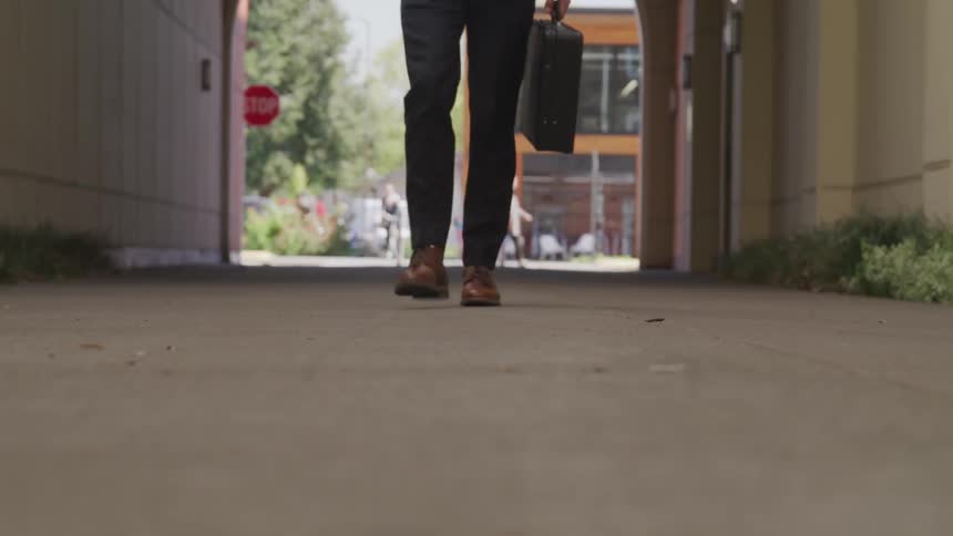 Man with suit walk in the street